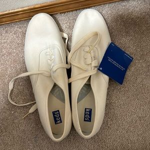 New old stock.  Never worn size 13 women’s keds white shoes.